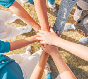 teammates-joining-hands-in-support-on-field-2026-09-24-15-08-02-utc Support hands, team motivation and sports baseball game on field, collaboration in teamwork and peo.